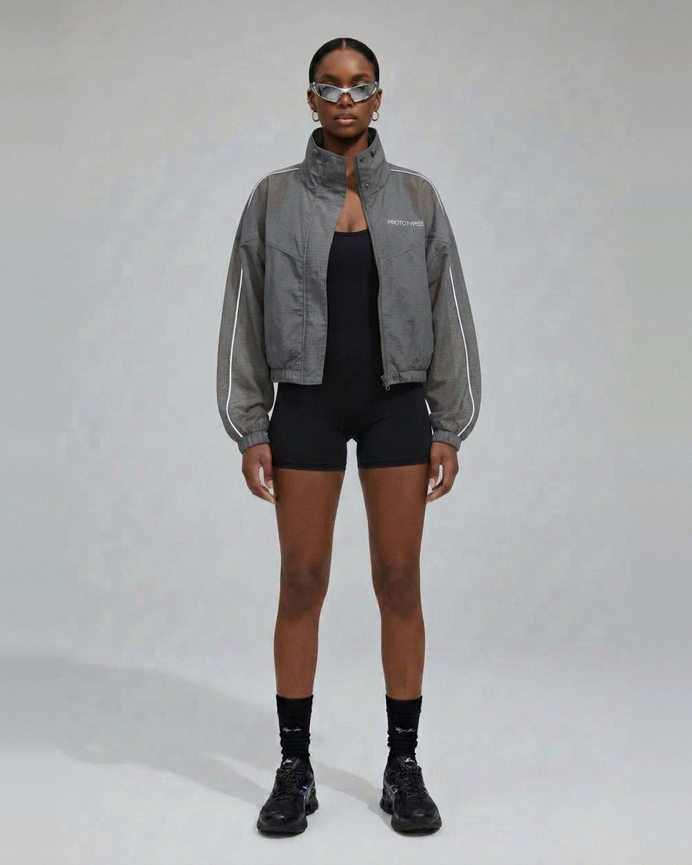 Paper Planes women's launch — athletic styling with headband and sunglasses