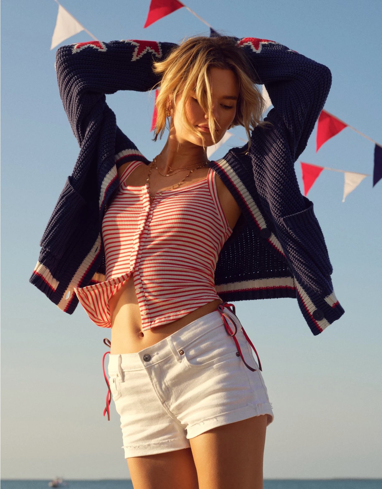 American Eagle — coastal summer styling with striped tank and navy cardigan